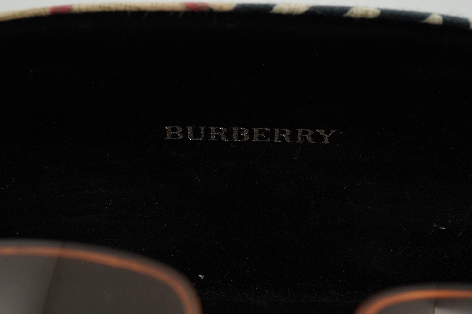 A Burberry brown tartan scarf, sunglasses with case and wallet with original box.